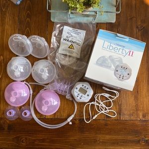 Freemie Liberty II breast pump with accessories